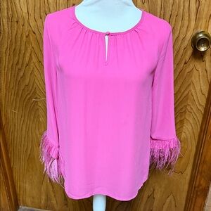 Cato top with feathered wrists. Size XS.